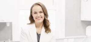 a professional headshot image of dr pippa nicolls from dimples oral care
